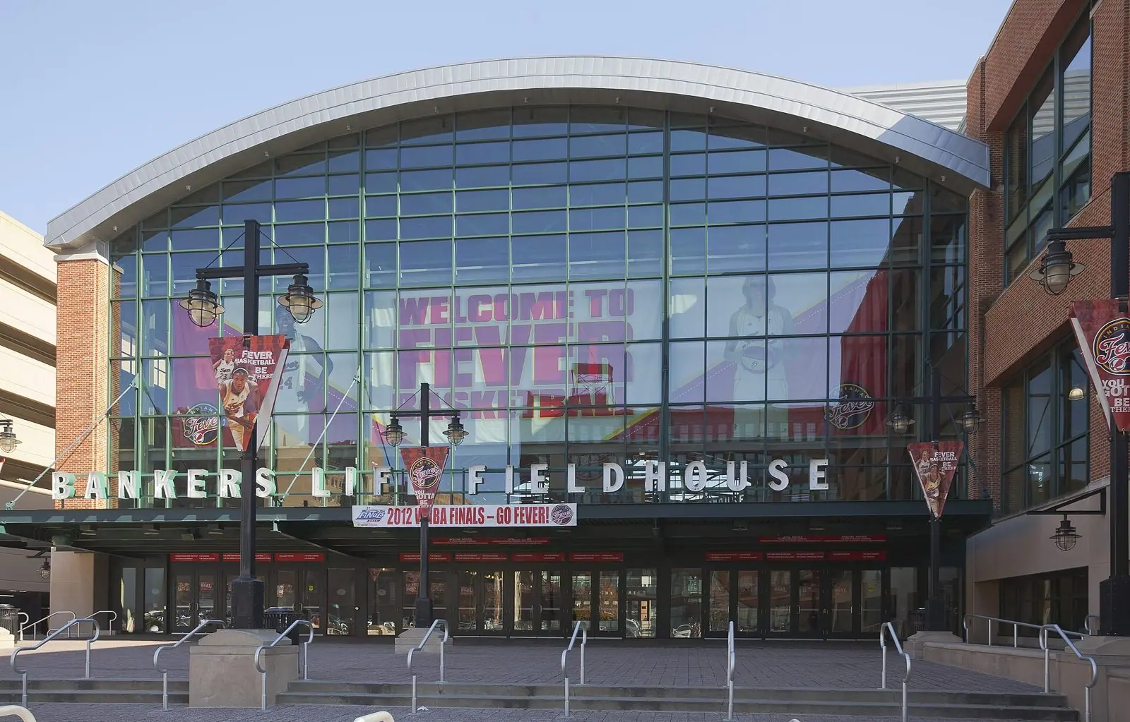 Glass-fronted main entrance of the Indianapolis arena, then named Bankers Life Fieldhouse, with banners and lettering above the doors